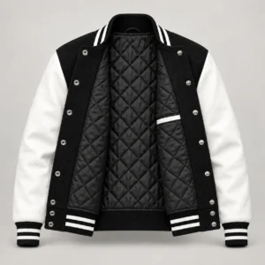 Black wool and white leather varsity jacket showing black quilted lining, left inside pocket and steel snap backs