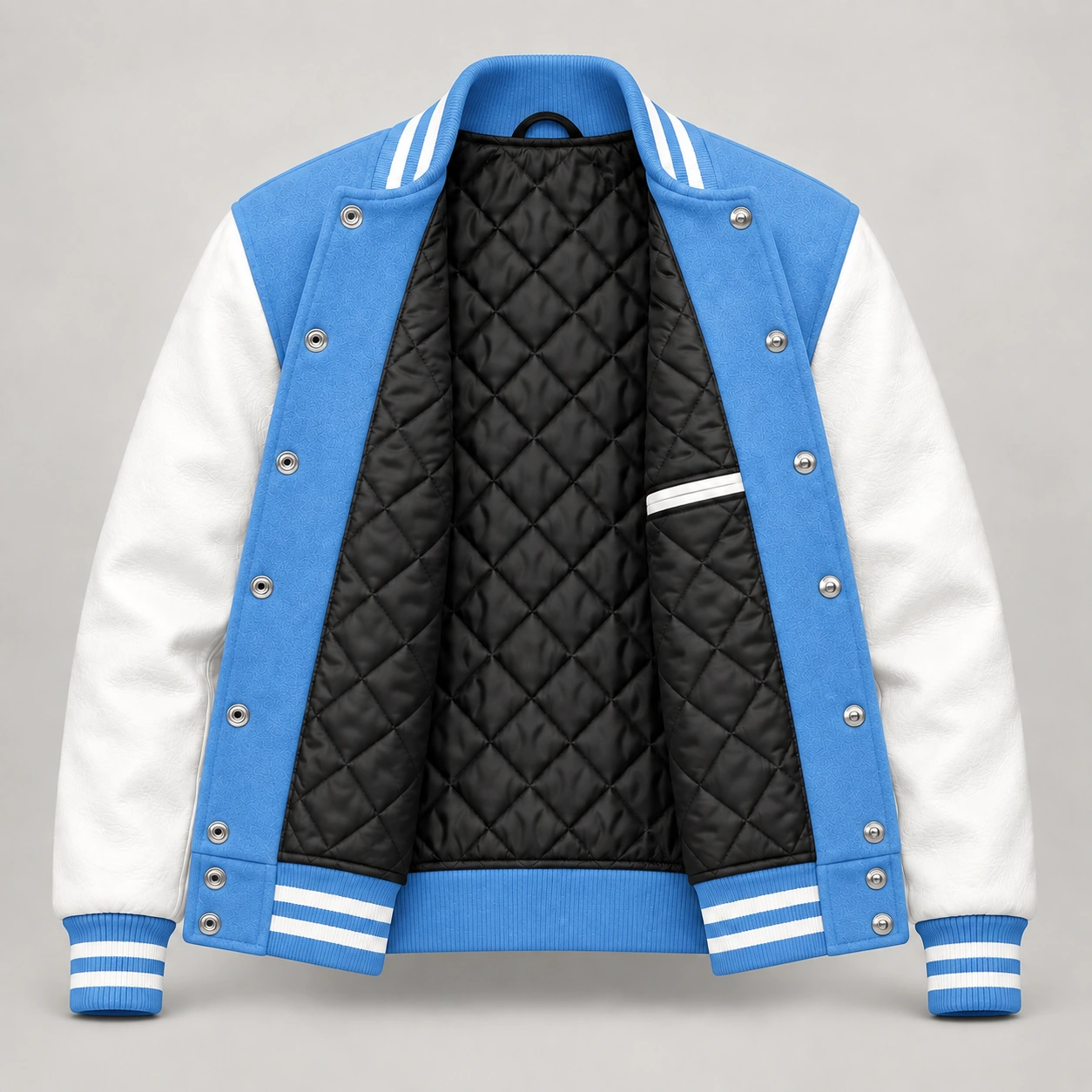 Light Blue Wool and White Leather Varsity Jacket, open black quilted lining with one left interior pocket and steel snap backs